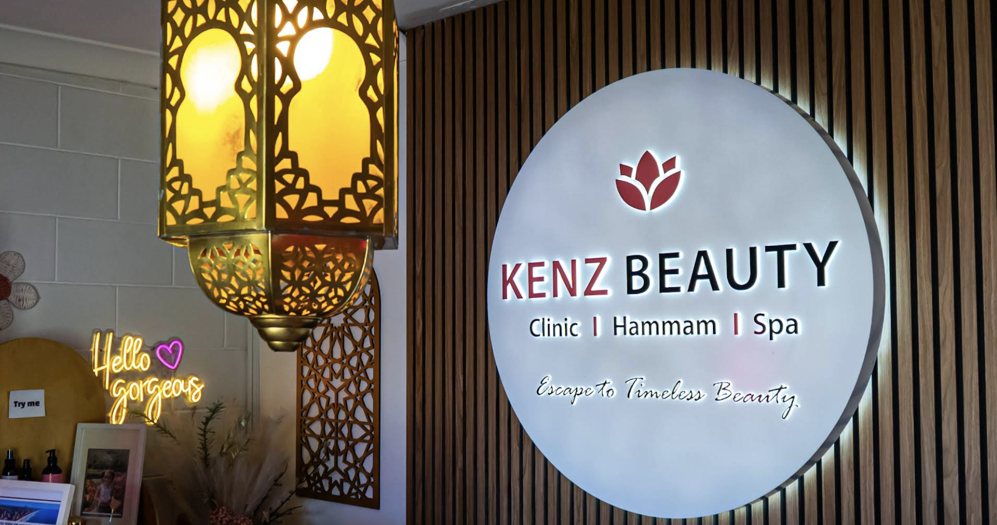 Illuminated Kenz Beauty Clinic, Hammam and Spa signage with a Moroccan lantern